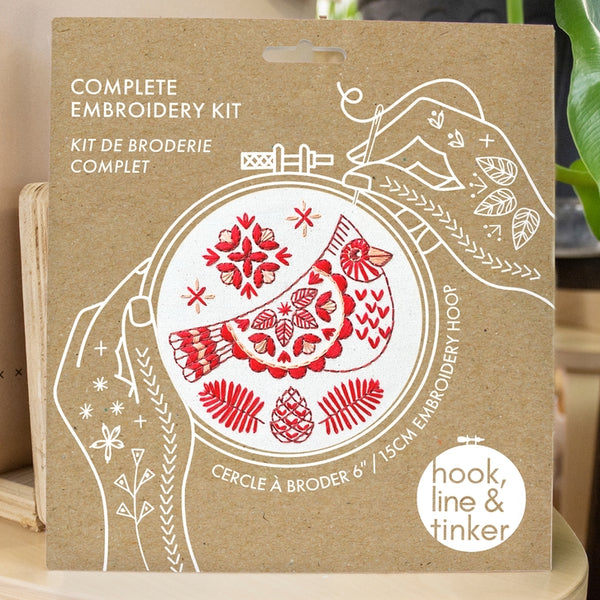 Embroidery kit featuring red cardinal in folk pattern