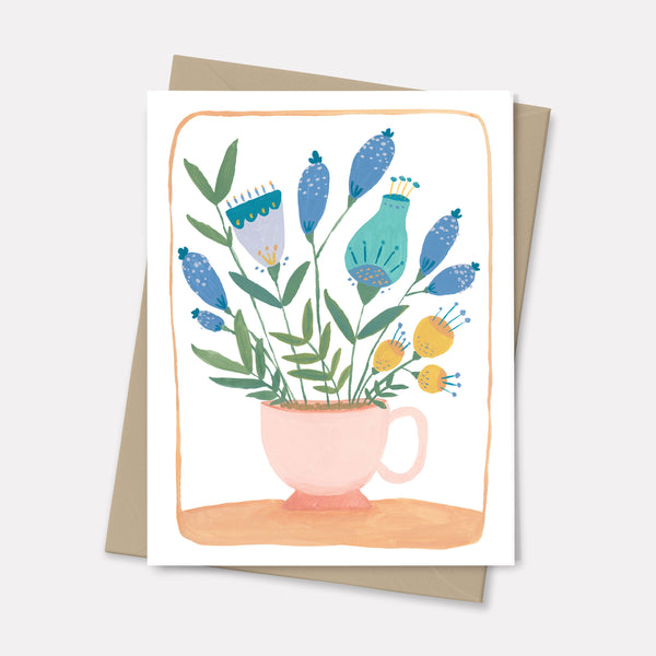 greeting card with design of folk flowers in teacup 